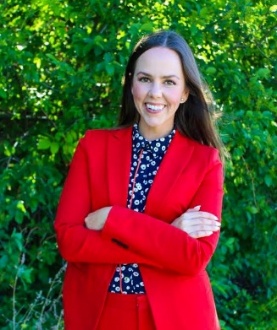 A person in a red suit</p>
<p>AI-generated content may be incorrect.